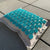 Side view of Dosha Mat Turquoise Acupressure Pillow