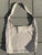 Flat lay of a Dosha Mat natural linen acupressure mat carrying bag